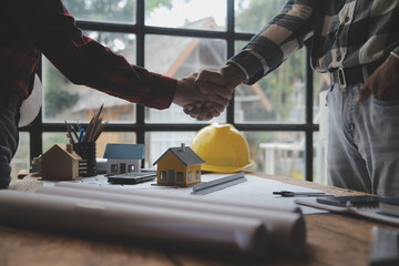 Engineer Teamwork Meeting, Drawing working on blueprint meeting for project working with partner on...