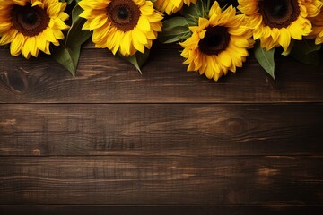 Beautiful sunflowers on a wooden background with copy space
