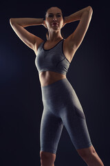 Obraz premium Sport woman on black background.