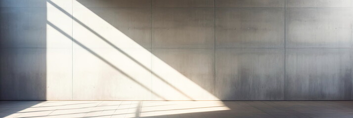 abstract architectural background capturing the interplay of light and shadow on a stark concrete wall