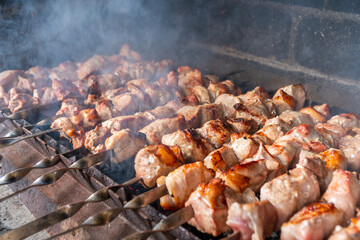 Traditional georgian mtsvadi, grill on the coals with smoke. Shashlik