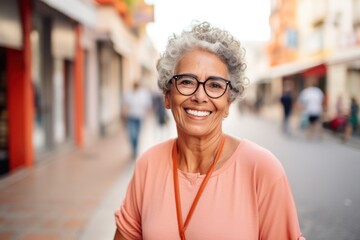 Smiling hispanic senior woman looking at the camera.