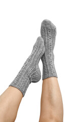 Female legs in grey hand knitted wool socks