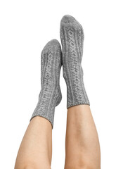 Female legs in grey hand knitted wool socks