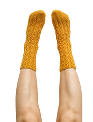 Female legs in yellow hand knitted wool socks