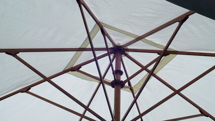 Underneath Large umbrella to protect against rain or sun. Restaurant and hotel equipment