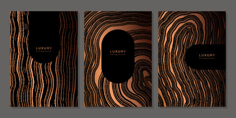 Set of templates. Luxury golden background with wood annual rings texture. Banner with tree ring pattern. Stamp of tree trunk in section. Wooden concentric circles. Black and bronze marble background © Morena