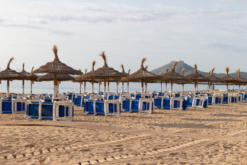 Beach chairs and with umbrella on the beach Spain.
