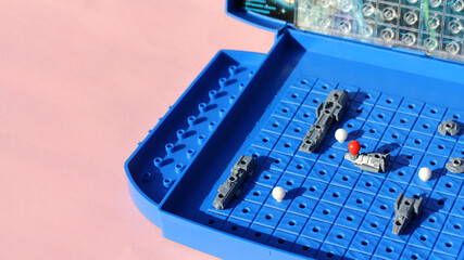 Board game sea battle. Photo taken with selective focus and noise effect.