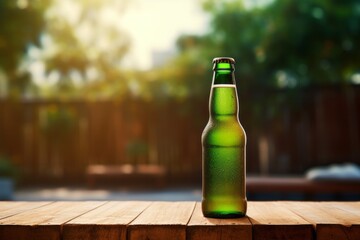 a green bottle of beer on a table with blurred background