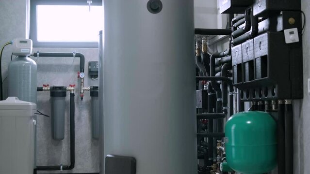 A modern electic boiler room. Equipment for modern heating system as a boiler, heater,pipes, expansion tank and other