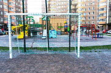 Fototapeta na wymiar Handball, football goal, gates with a net. Sports ground in a residential complex