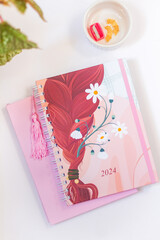 2024 Stationary. Feminine flat lay composition with planner.