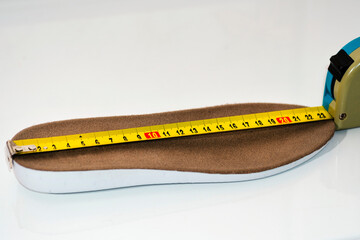 Shoe size measurement. Measure tape measure insoles. shoes size concept. close-up.  measure...