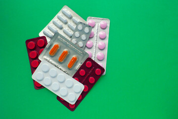 Medicine, antibiotics for treatment. Pills top view with copy space.