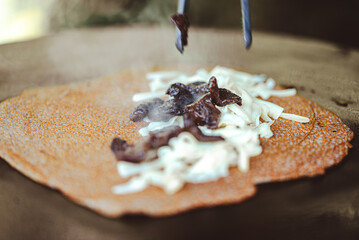 breton galette. buckwheat crepe. making buckwheat pancakes.