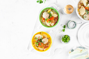 Spring bright soup with meatballs and vegetables. Copy space.