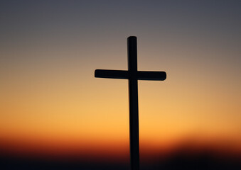 cross on the hill at sunset