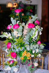 Multicolored floral arrangement made with organic flowers in outdoor space, wedding celebration and family celebration, show of love and hope. - 642217686