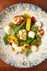 vegetables salad with cheese and dressing