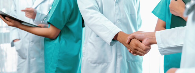 Group of medical staff doctor nurse and healthcare specialist profession handshaking in hospital....