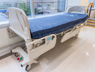 Hospital beds symbolize comfort and care. Patients' refuge during illness, a place of healing and...