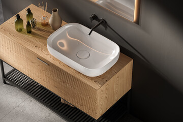 Close up of sink with mirror hanging in on gray wall , wooden cabinet with white ceramic sink and black faucet in minimalist bathroom. Side view.
