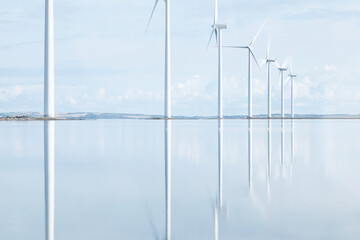 Windmills reflecting in danish Fjord. High quality photo - 642230216