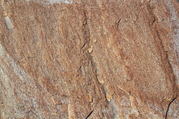 Mountain rock texture. Natural brown slate granite slab marble stone ceramic seamless tile rough surface background. Architecture grunge modern abstract style element. Close-up, copy space