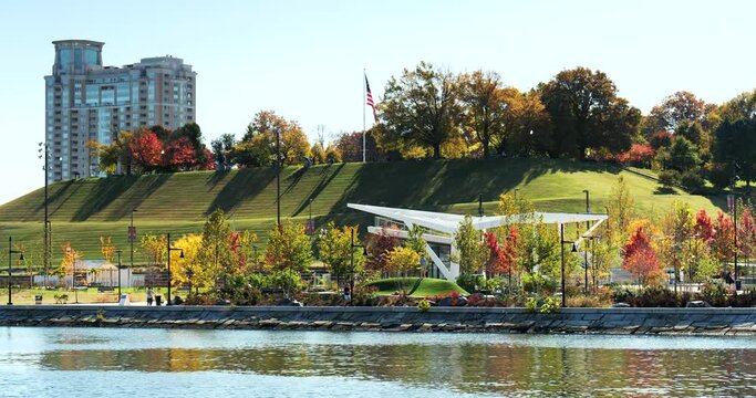 Downtown cityscape and Federal Hill Park on the Inner Harbor of Baltimore Maryland flowing out to the Patapsco River and Chesapeake Bay