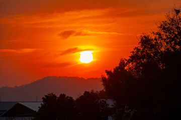 Amazing sky at sunset. Gradient color. Sky texture, abstract nature background..Sunset with red color light rays and other atmospheric effects..Big sunset and sweet lighting sky. phone antenna post.