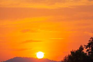 Amazing sky at sunset. Gradient color. Sky texture, abstract nature background..Sunset with red color light rays and other atmospheric effects..Big sunset and sweet lighting sky. phone antenna post.