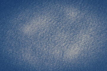 Navy blue felt fabric texture background with black vignette. Vintage grunge background texture. 