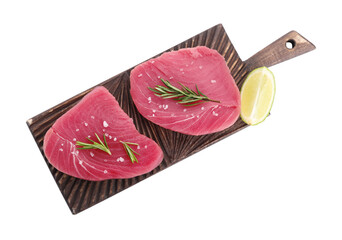 Raw tuna fillets with salt, rosemary and lime wedge on white background, top view