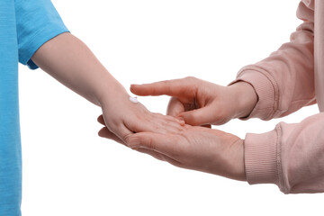 Mother applying ointment onto her son`s hand on white background, closeup