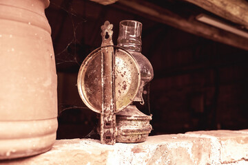 Antique petroleum lamp in an old barn.High quality photo.