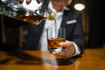 Businessmen in suits drinking whiskey
