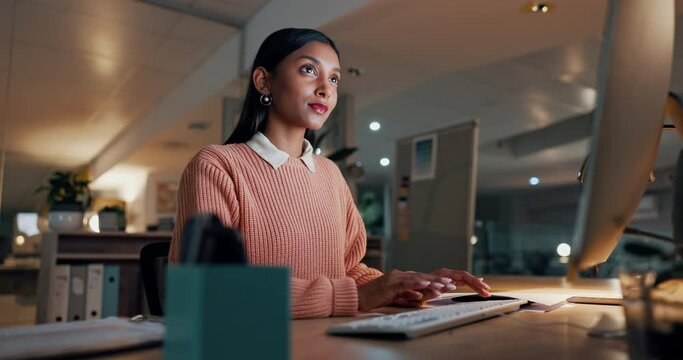 Business woman, writer and typing on computer for social media copywriting, blog update and research at night. Young indian worker, editor or employee on keyboard and office desktop for editing