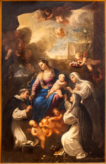 NAPLES, ITALY - APRIL 20, 2023: The painting of Madonna presenting the Rosary to st. Dominic in the church Basilica di Santa Maria della Sanita by Giovanni Balducci (1560 – 1631).