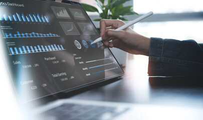 Businessman using digital tablet analyzing sales data and financial growth graph chart report. Business planning, strategy and development. Financial and banking. market research, data analysis