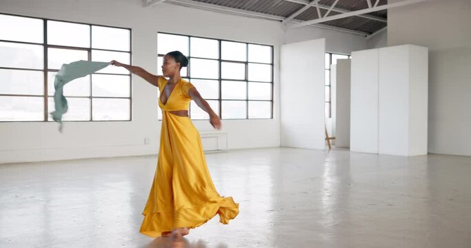 Dress, dancing and a woman for performance in a creative art studio with energy and passion. African contemporary dancer practice for theater, sports and freedom with balance, textile and talent