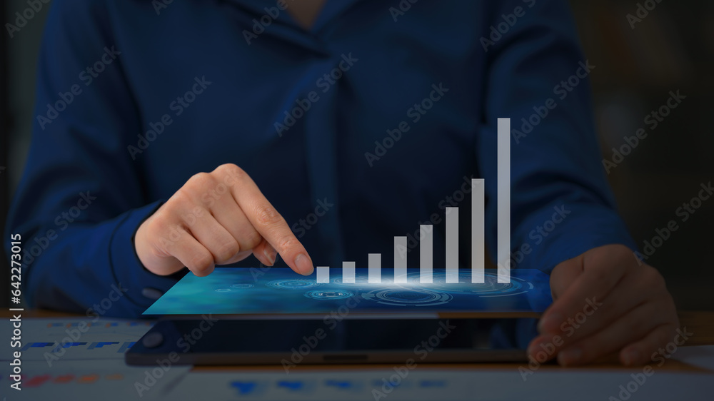 Poster close-up of businesswoman's hand working on a tablet computer with digital layer business strategy.