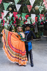 Latin couple of dancers wearing traditional Mexican dress from Guadalajara Jalisco Mexico Latin...