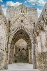 Fototapeta na wymiar Ruined Gothic abbey on the Rock of Cashel with majestic Gothic arches and windows