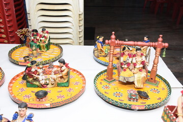 colorful clay dolls describing Tamil brahmin wedding couple on their wedding day