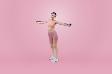 Fototapeta na wymiar Vigorous energetic woman in sportswear portrait stretching resistance sport band. Young athletic asian woman strength and endurance training session workout routine concept on isolated background.