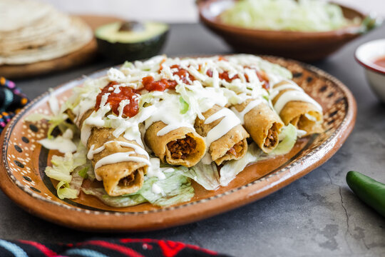 Mexican tacos dorados called flautas with chicken, traditional fried food in Mexico Latin America	