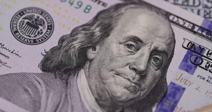 Take a hundred American dollars close-up, American genuine cash with a face value of one hundred dollars