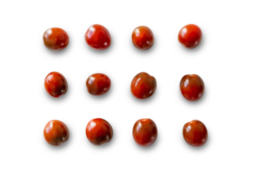 Closeup of fresh juicy organic red cherry tomatoes from the garden with shadows isolated on a transparent background from above, top view