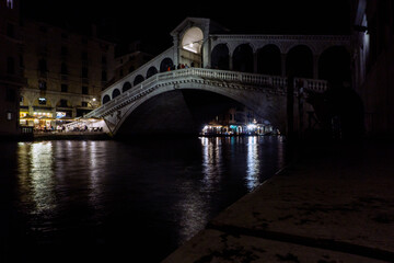 Rialto Bridge across Grand Canal in Venice during late night without tourists in Venice, Italy.